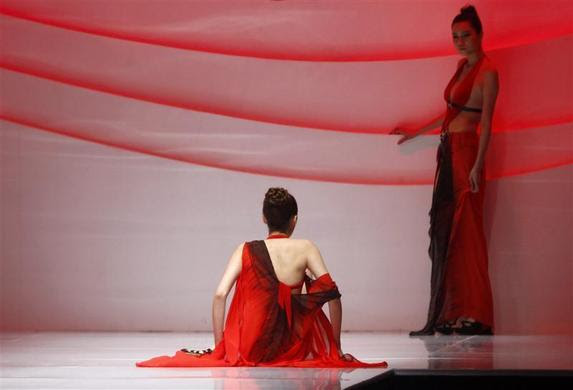 A model falls while presenting a creation for the Seventh Hosa Cup China Swimwear Design Contest during China Fashion Week in Beijing, March 28, 2011. REUTERS-Jason Lee