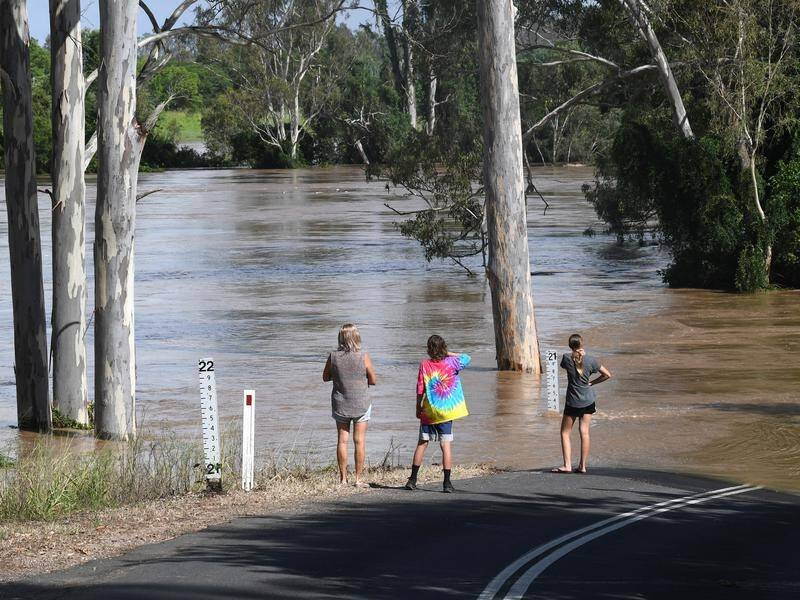 Qld rains ease but flood warnings remain