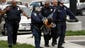 Baltimore Police officers arrest a man near Mowdawmin