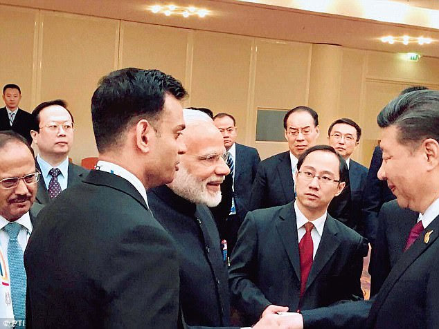 Prime Minister Narendra Modi and Chinese President Xi Jinping exchange greetings at  BRICS