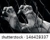 Hands of a missing kidnapped, abused, hostage, victim woman in emotional stress and pain, afraid, restricted, trapped, call for help, struggle, terrified, locked in a cage cell. - stock photo