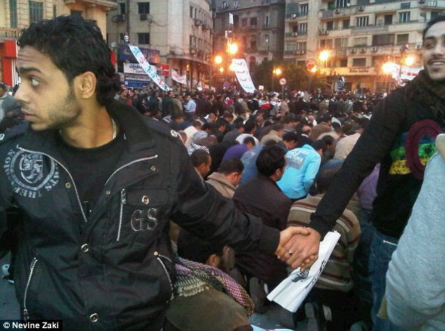 Christians faced outward and joined hands in a circle to protect a Muslim group of protesters as they prayed in Egypt