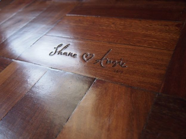 Dear future me: carve names into wood floor of house built together.