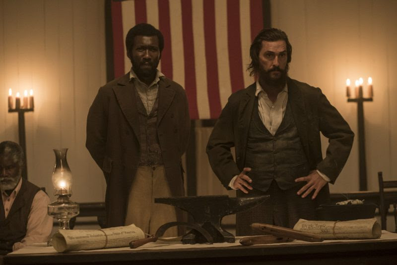 At a meeting of the Union League, Moses (Mahershala Ali) and Newt (Matthew McConaughey) tell the Freedman that all citizens shall have the right to vote.