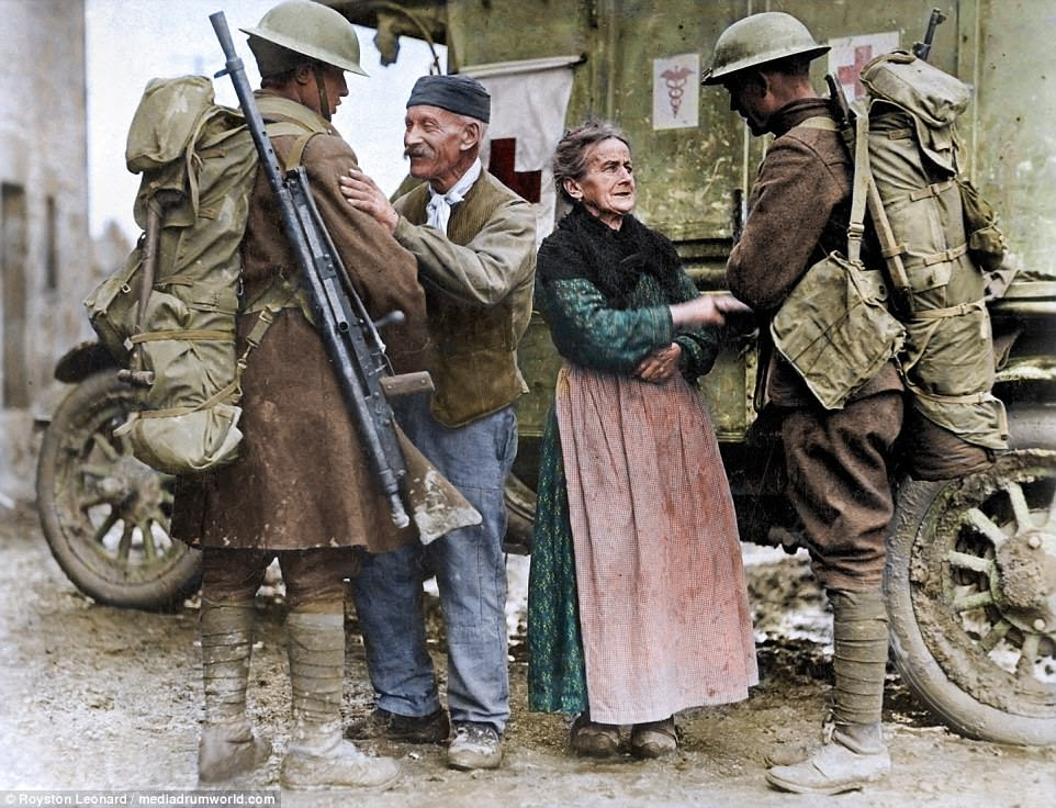 An old French couple, M. and Mme. Baloux of Brieulles-sur-Bar, France, under German occupation for four years, greeting soldiers of the 308th and 166th Infantry upon their arrival during the American advance 