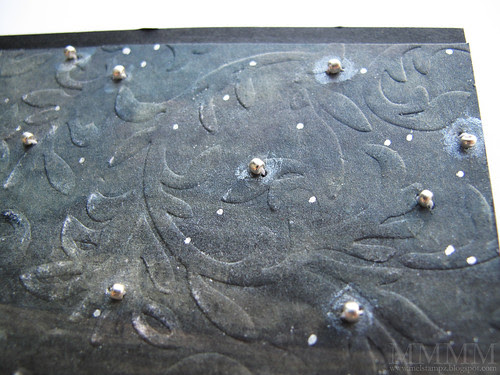 Pierced holes to stitched on beads and added white paint and glitter pen to make the stars glow