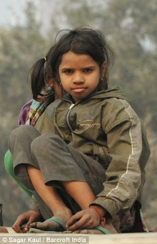 Homeless children spend most of their time playing near railway tracks in New Delhi 