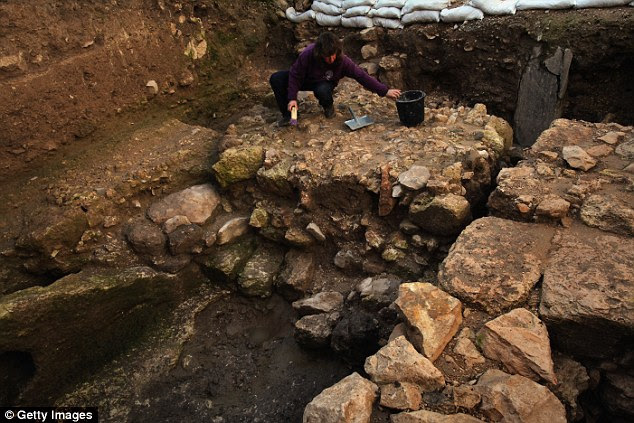 The last attempt to identify the house where Jesus grew up was in 2009 when archaeologists from the Israel Antiquities Authority found another 1st century home they believed had been occupied by a Jewish family. Pictured an Israeli Antiquities Authority worker clears debris during the 2009 excavation