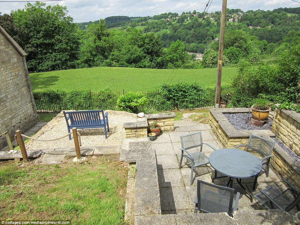 The detached chapel in Minchinhampton, near Stroud, is situated in stunning Cotswolds countryside, which can be gazed upon from the outdoor seating on the patio (pictured)