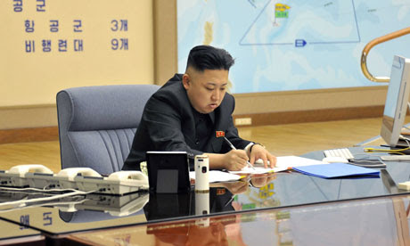 Kim Jong Un attending a meeting with top military officials