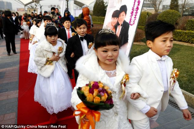 Tying the knot: All 14 people were from the Tianpi Shadow Play Troupe. They ranged in age from 21 to 27 years old