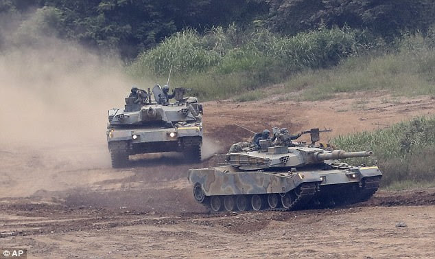 The South Korean army's K-1 tanks take part in a military exercise in Paju, South Korea this morning