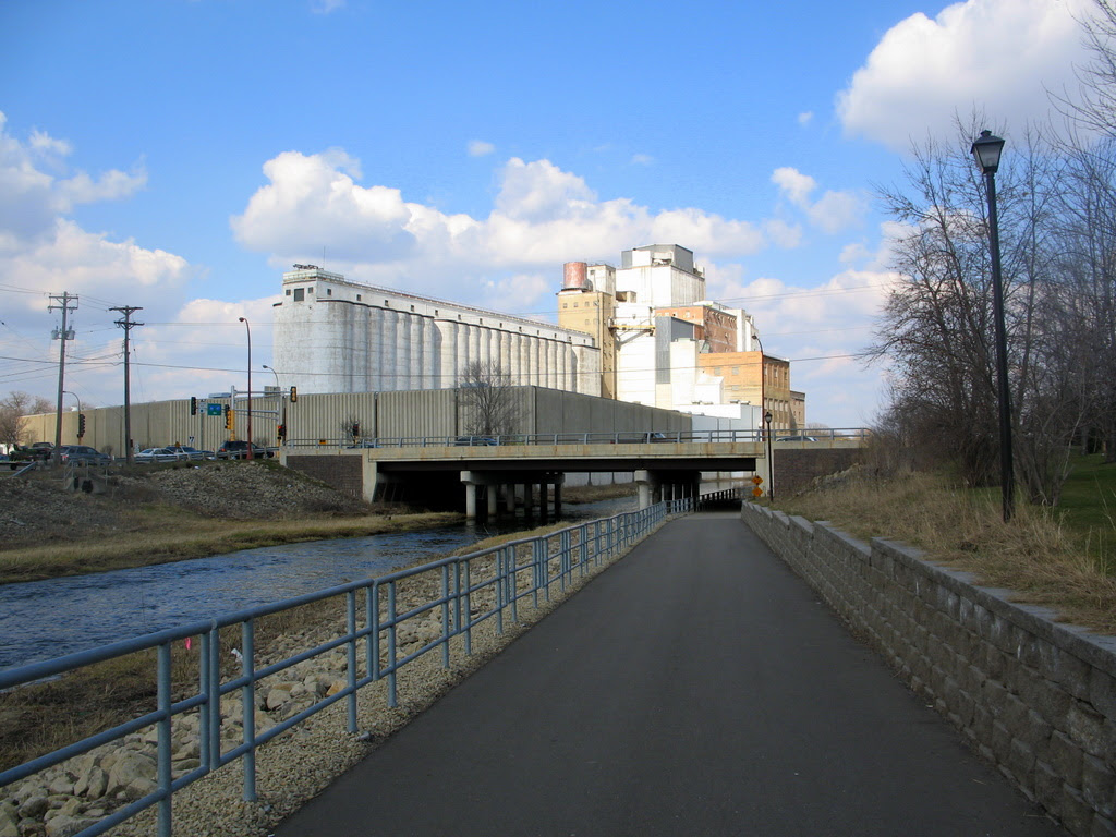 On a walking path in Hastings, Minnesota. In the background is the Hastings Flour Mill which runs along the Vermillion River.