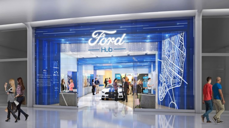 A Ford stall with people inside looking at a car