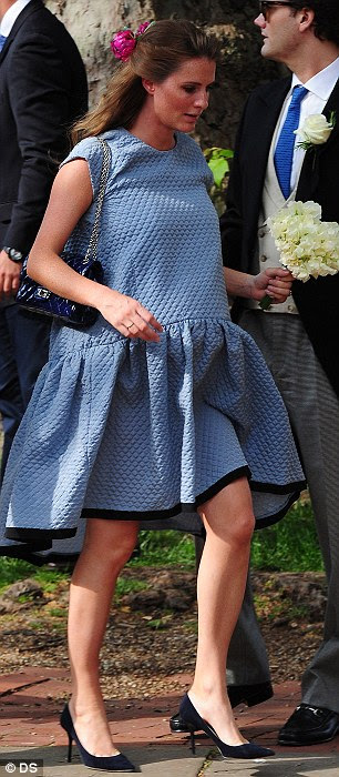 Floaty fashion: Pregnant Chloe Delevinge (L) wore the £1,500 cloud dress designed by Victoria Beckham (R) to sister Poppy's wedding in Knightsbridge on Friday