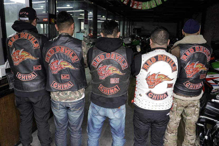 Red Devil members show off their club jackets in Shanghai, Jan. 27, 2018. Kenrick Davis/Sixth Tone