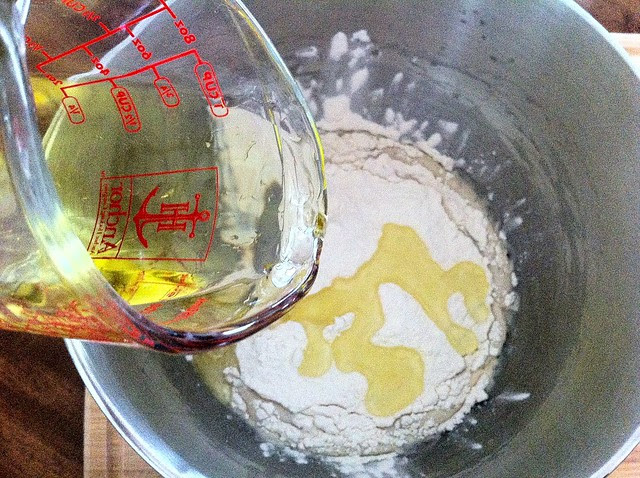 Olive Oil Added to Bowl