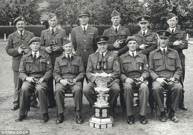 AVMl William Staton (front centre) with the winners trophy from a shooting competition
