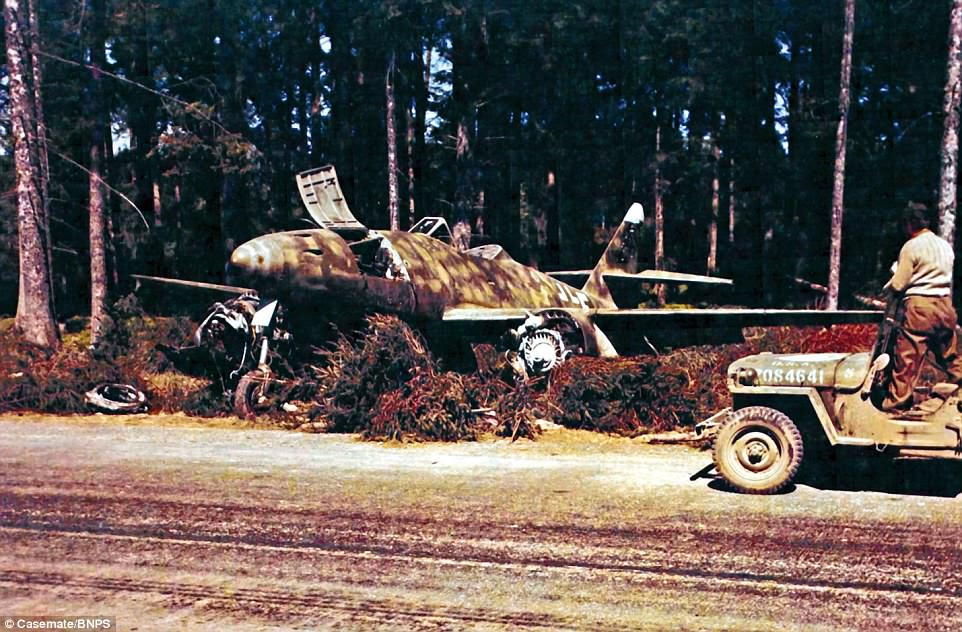 A downed Messerschmitt 262 is discovered by American troops in a forest south east of Munich, date unknown. The Me 262 was the world's first jet-powered fighter aircraft and ushered in a new age of plane design