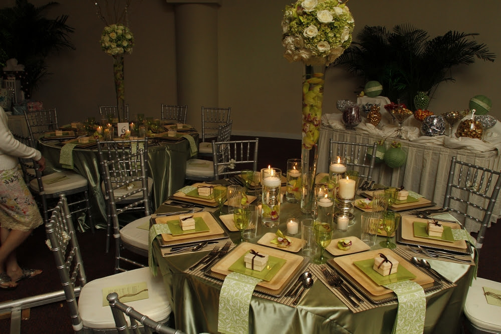 The enchanted garden wedding reception with a sage green and natural wood 