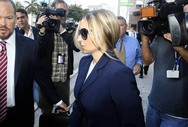 Kim Rothstein, Scott Rothstein's wife, leaves the federal courthouse after she plead guilty to a plot to hide more than $1 million in jewels from the feds.