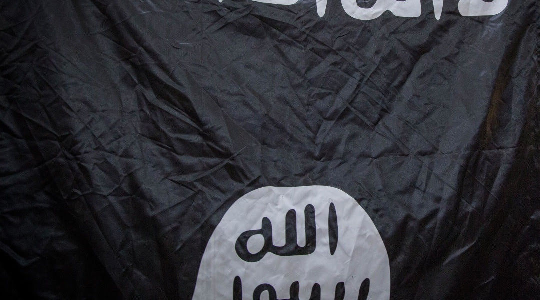 Image:A captured ISIS flag is shown in northern Iraq, Aug. 18, 2014. 