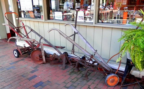 Some of Big Ed's historic plows in front of the restaurant.