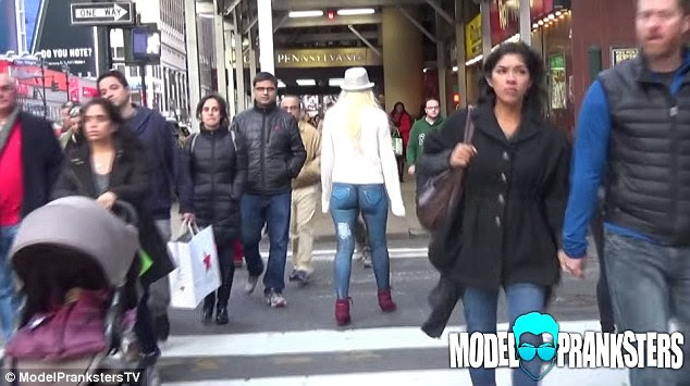 Don't give a damn: As the model ventured out on the streets of New York, she was filmed from behind to gauge the reaction of the people who passed her