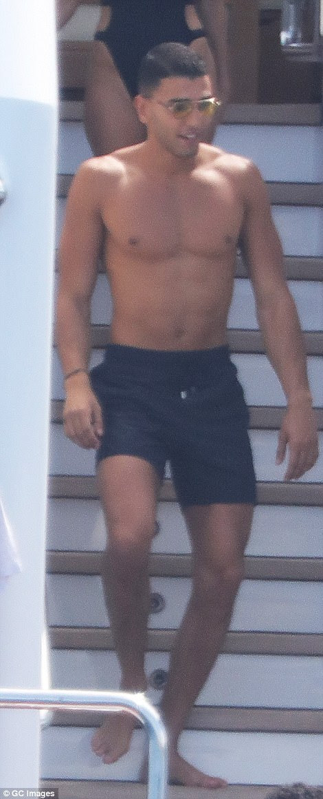 Handsome: Younes showed off his muscular physique in a pair of black board shorts