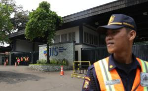 In this Thursday, May 8, 2014 photo, a security guard …