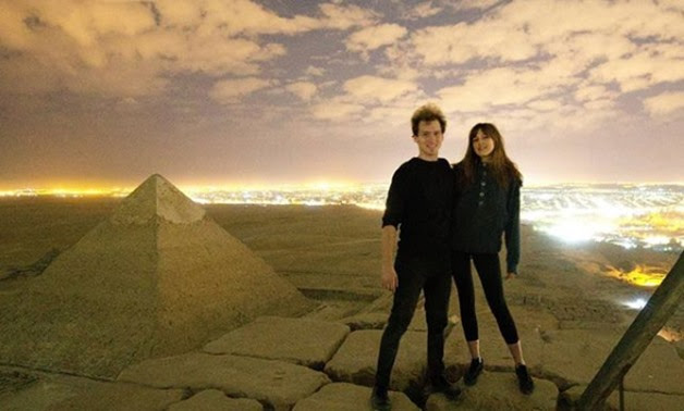 Danish Photographer Andreas Hvid with his girl friend        allegedly atop of Giza Pyramid - screenshot of video 