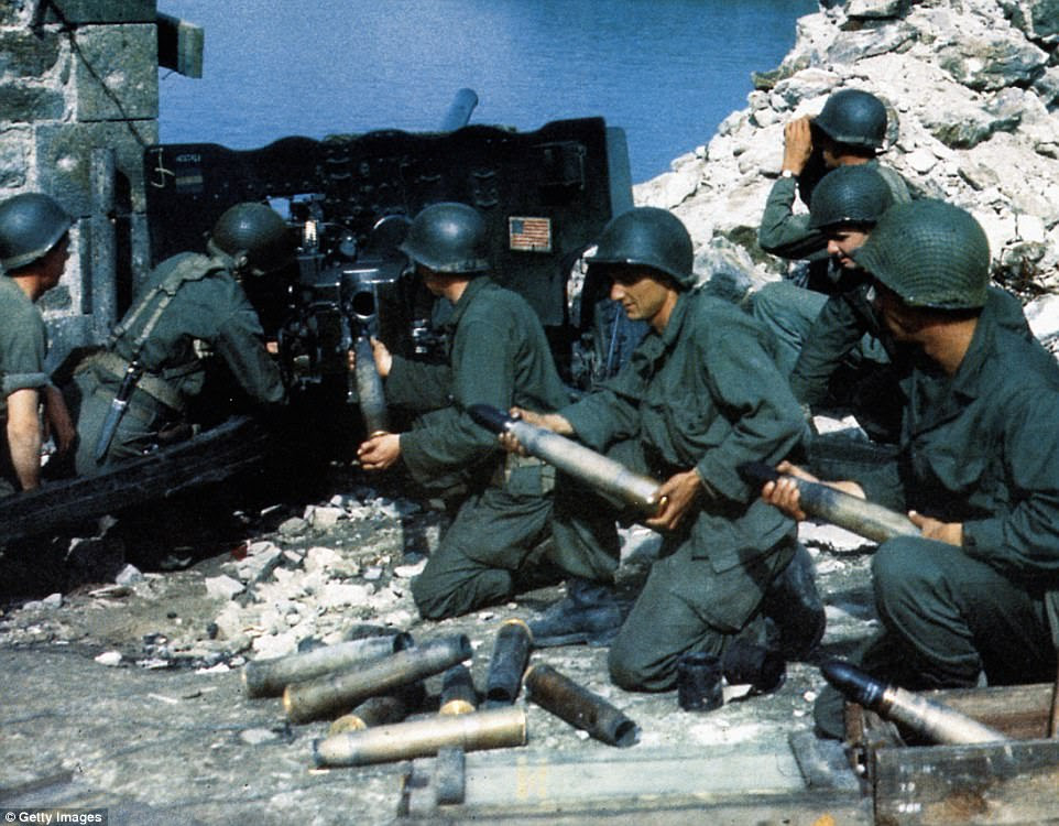 Much of Hitler's demands lay unfinished, by June 1944 Fortress St Malo was said to be one of the best defended installations along the Atlantic coast. Pictured: US infantrymen use anti-tank gun at German positions in St Malo