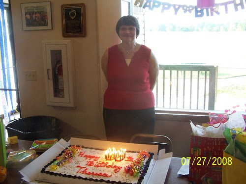 Mom with lit cake