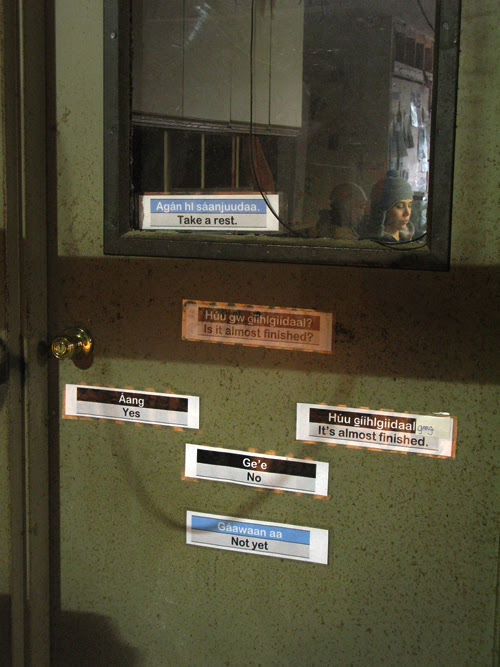 Haida language signs on a door inside the carving shed, Hydaburg, Alaska