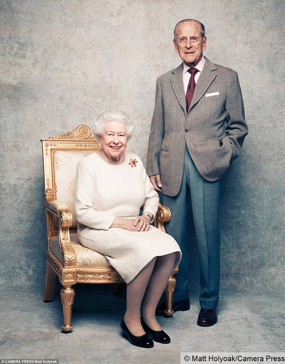 The photographs, shot at Windsor Castle, show the Queen smiling as she is seated next to her husband of seven decades. The Queen wore the yellow gold, carved ruby and diamond Sacarb brooch that was gifted to her by her husband in 1966