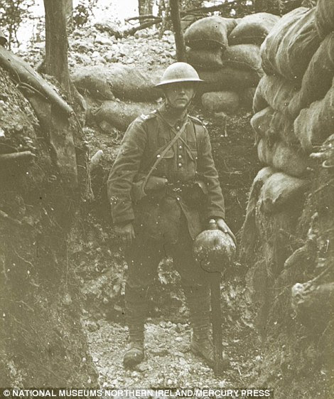Portrait: John Ewing, a fellow soldier of Lance Corporal Hackney, is pictured with a 'Plum Pudding' mortar in one of the many photographs in the collection