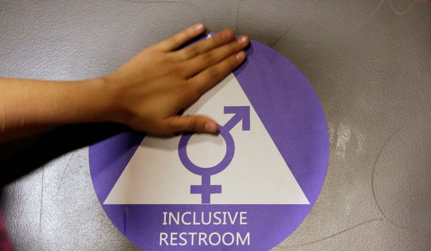 Gender-neutral bathrooms may become more common with the flurry of legislative activity over which public facilities transgender people will be allowed to legally use. (Associated Press) ** FILE ** 