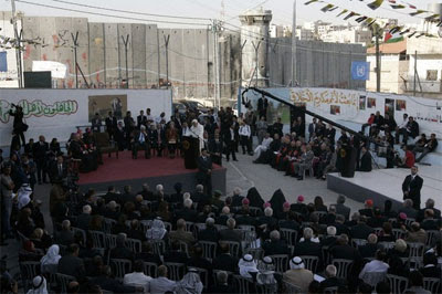 Pope Benedict XVI speaks during his visit to the Aida refugee camp, with the Israeli separation barrier in the background, near the West Bank city of Bethlehem on May 13, 2009. Source: Getty Images