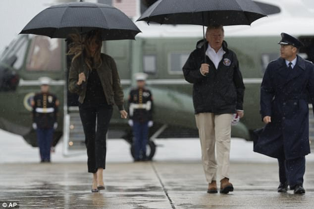 President Donald Trump and first lady Melania Trump walk from Marine One to board Air Force One at Andrews Air Force Base, Maryland, ahead of  a trip to Texas to get an update on Hurricane Harvey relief efforts