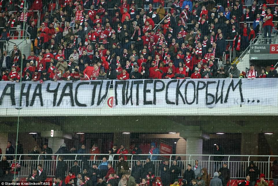 Spartak Moscow's fans hold a banner in memory of the St Petersburg metro explosion victims at their league match tonight