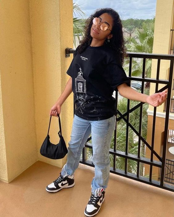 Picture of a lady rocking a tee and the sneakers