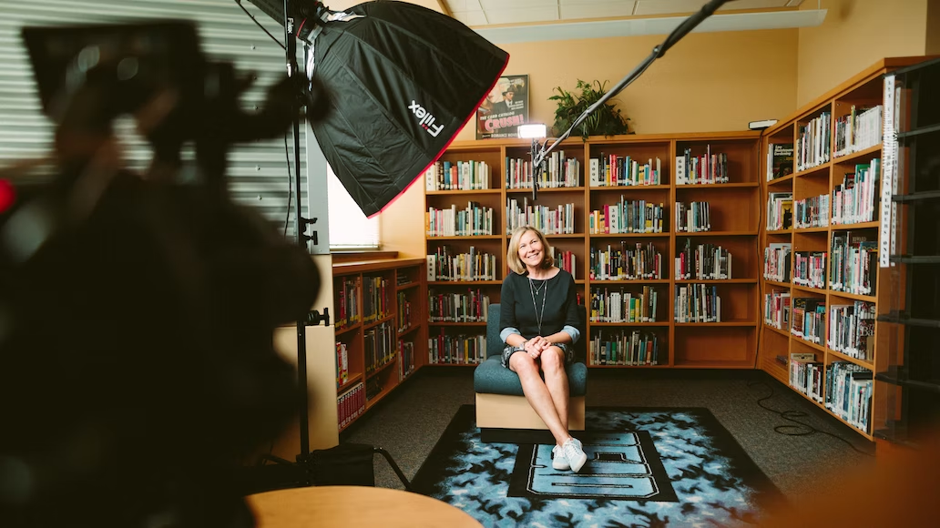 a woman talking in front of camera