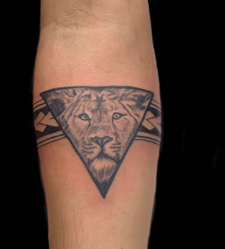 Lion Inside Triangle Tattoo 