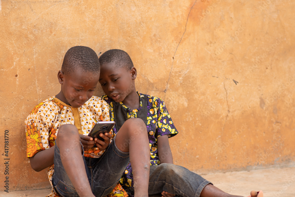 Children looking at a smartphone