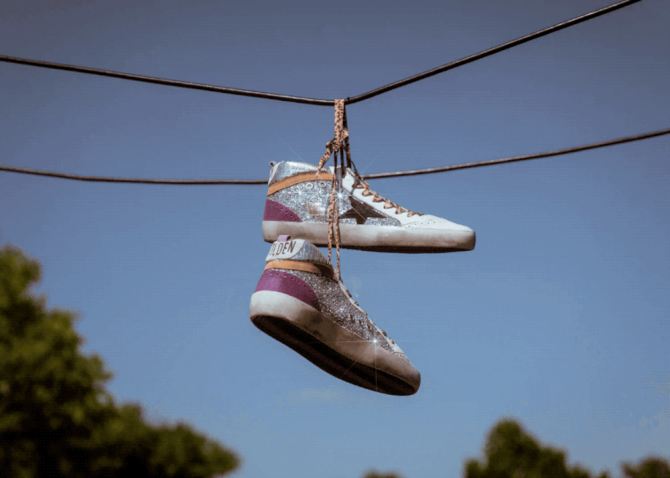 This GIF is by photographer Jami Clayman and is an example of how you can get creative with your self-assigned project. It shows a glittery, shiny pair of sneakers swinging as they hang by their leopard print laces on some wires. 