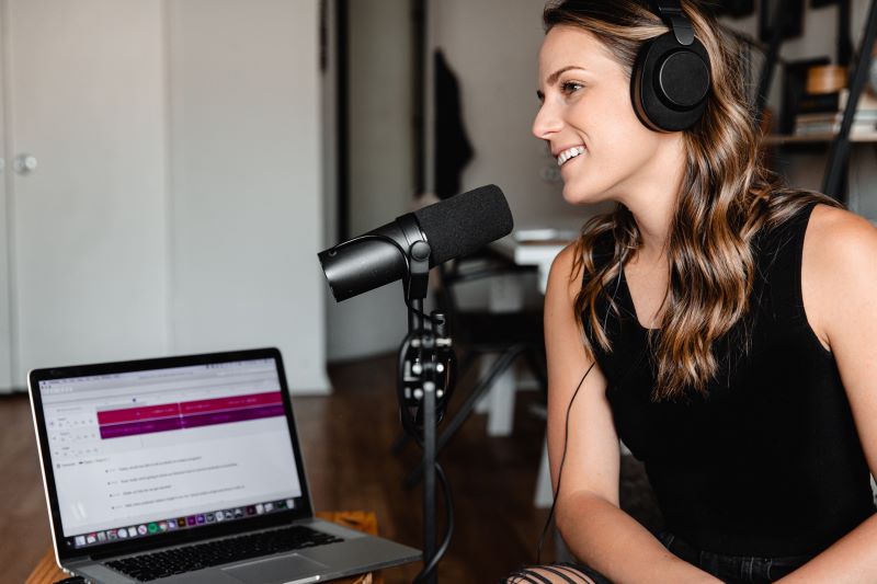 Woman podcasting as a hobby to make extra money.