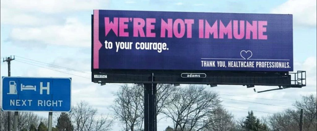 Billboard saying "We're not immune to your courage. Thank you, healthcare professionals."