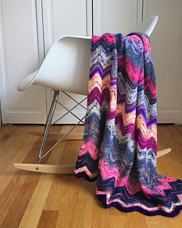 chevron blanket knitting pattern made from yarn scraps in pink and purple