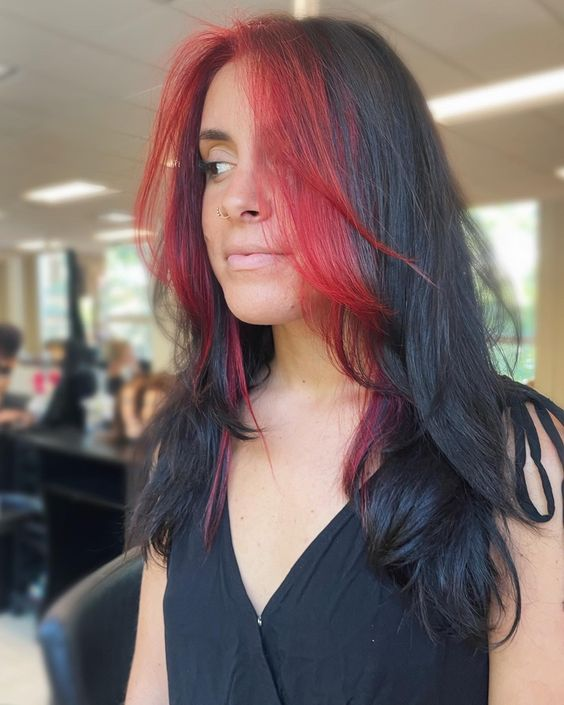 Picture of a young lady rocking her red  and black hair