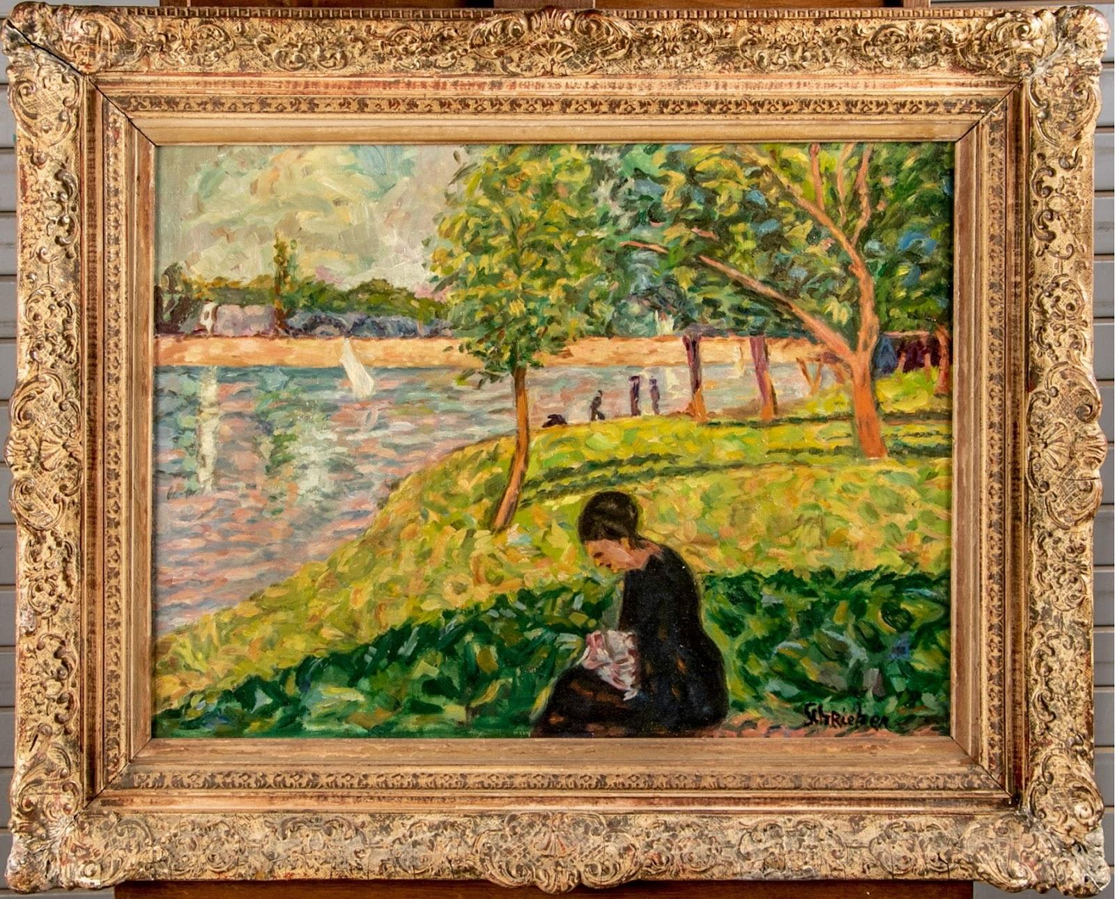 A lovely gilt frame surrounds this painting of a lady sitting by a lake.